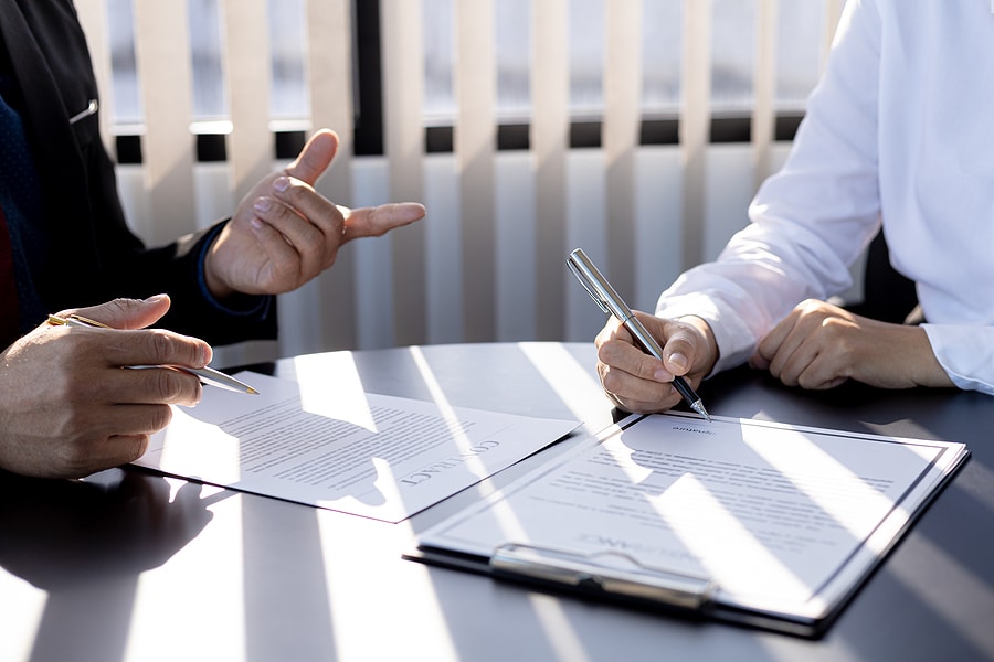 The insurance agent is explaining the details of the policy and the benefits