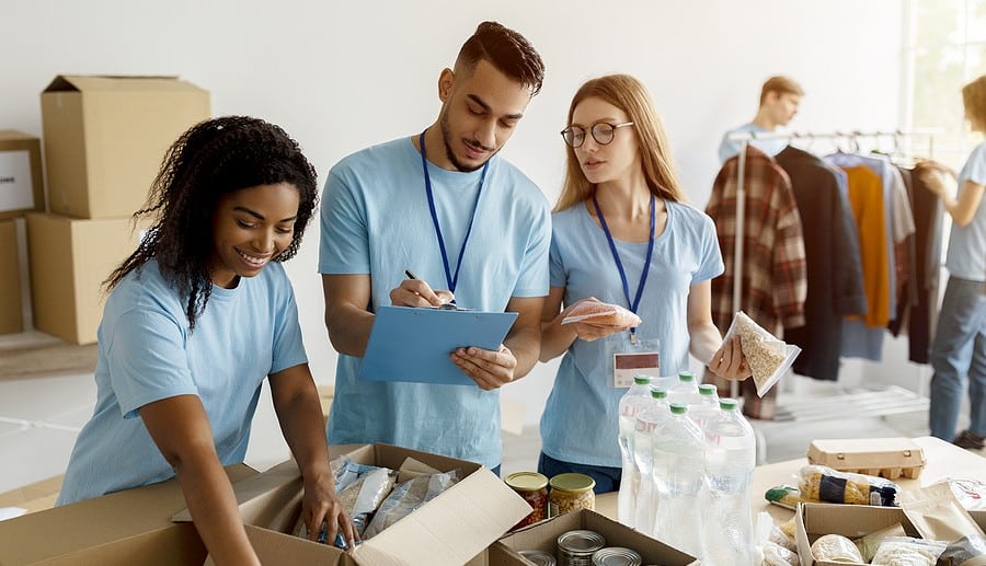 Volunteers at a Philadelphia non-profit are checking donation list.